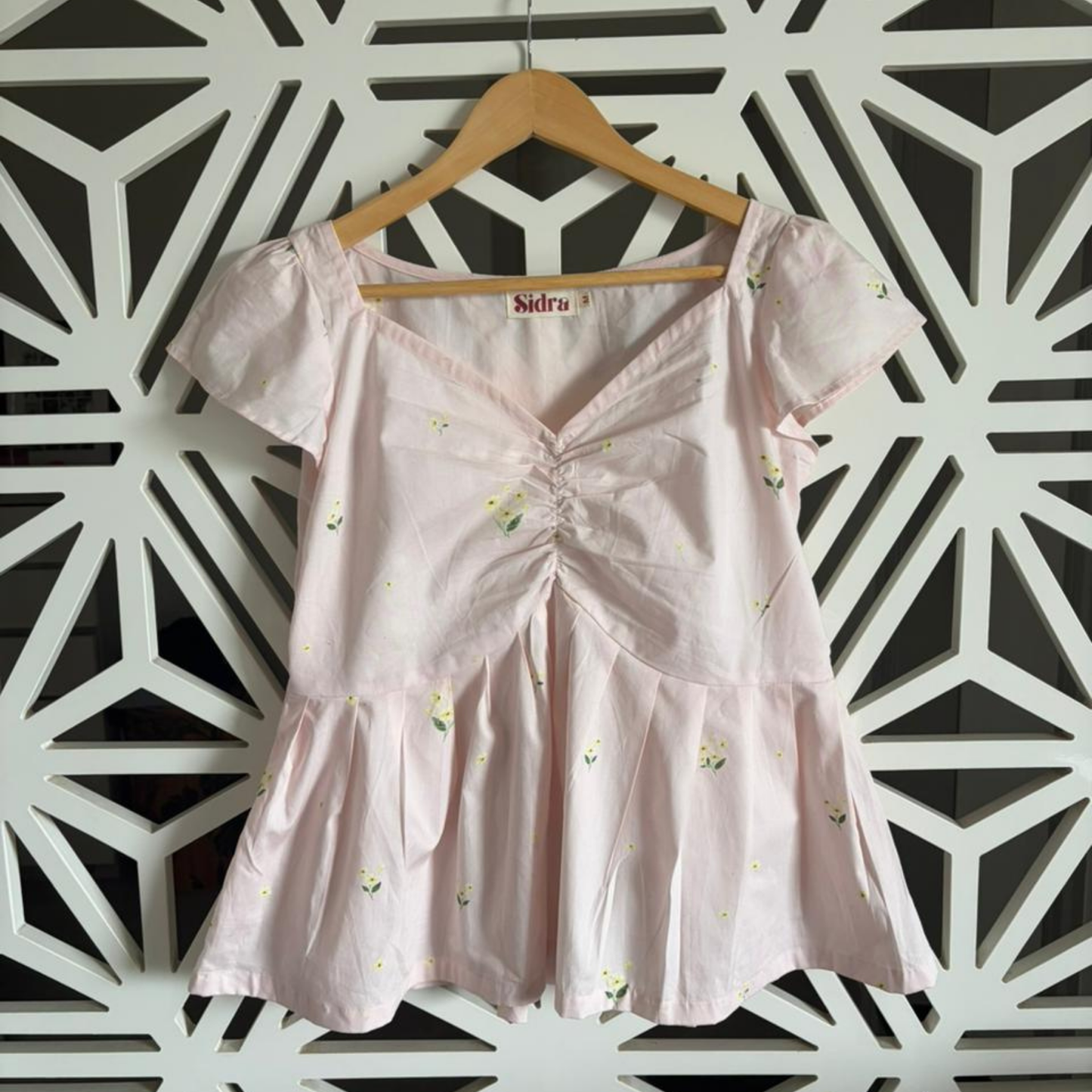 Pink peplum top